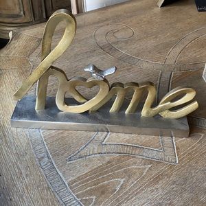 Pier one home sign with gold and silver